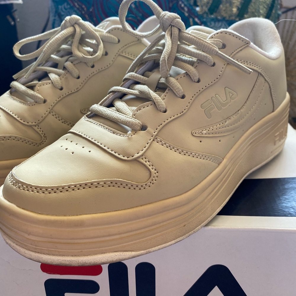 Women’s size 8 tan FILA sneakers.
